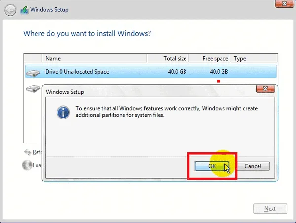 Click OK khi Windows yêu cầu tạo thêm phân vùng hệ thống